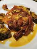 Cuixes de'ànec amb carxofes i salsa de taronja i Porto