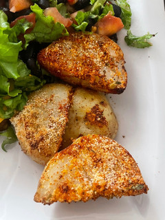 Una foto de Papitas asadas con queso parmesano