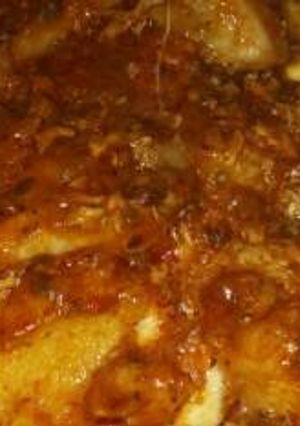 Una foto de Polenta con queso y estofado de pollo