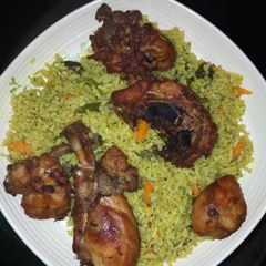 A picture of Fried rice and chicken.