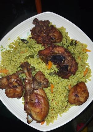 A picture of Fried rice and chicken.