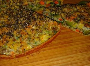 Una foto de Tarta de zapallitos, zanahoria y avena arrollada