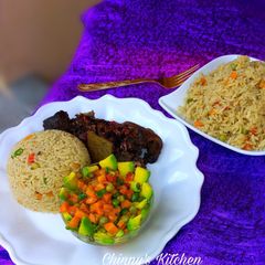 A picture of Coconut rice, avocado salad and fried goat meat.