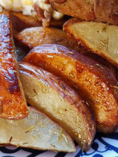 Una foto de Papas marinadas al horno