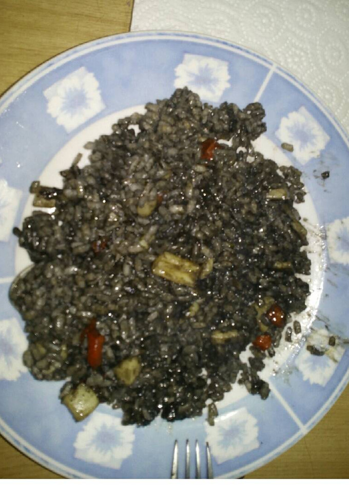 Una foto de Arroz negro con alioli