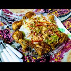 A picture of Chinese rice with drum sticks.