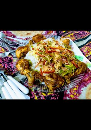 A picture of Chinese rice with drum sticks.