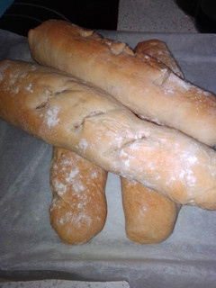 Una foto de Baguette con aceite de oliva y suero de queso