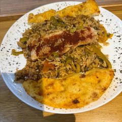 A picture of One Pot Steamed White Fish and Savory Rice with Roasted Garlic and Tomato Sauce.
