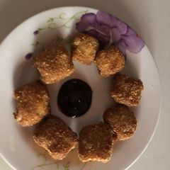 A picture of Chicken nugget and cheese.