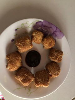A picture of Chicken nugget and cheese.