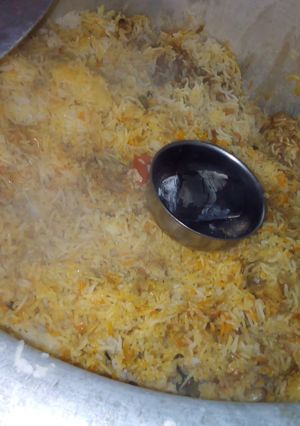 A picture of Smokey Chicken Biryani.