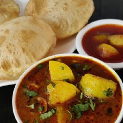 A picture of Poori-Bhaji(simple potatoes curry with poori).