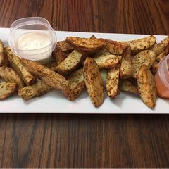 A picture of Baked garlic parmesan potato wedges.