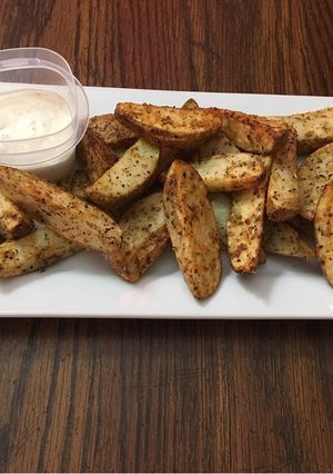 A picture of Baked garlic parmesan potato wedges.
