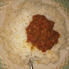 A picture of White rice and stew.