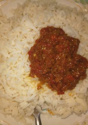 A picture of White rice and stew.
