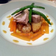 A picture of Pork and apple spiral with glazed carrots.