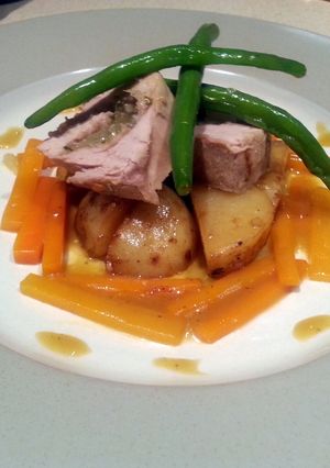 A picture of Pork and apple spiral with glazed carrots.