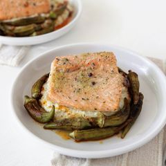 A picture of Roasted Salmon with Okra, Grits, and Sherry Paprika Vinaigrette.