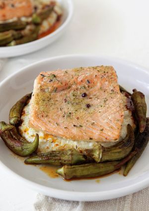 A picture of Roasted Salmon with Okra, Grits, and Sherry Paprika Vinaigrette.