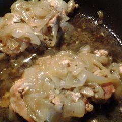 A picture of Braised Porkchops w/ garlic, sage, and onions.