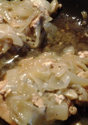A picture of Braised Porkchops w/ garlic, sage, and onions.
