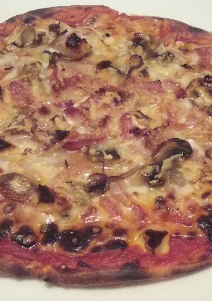 Una foto de Pizza champis y Bacon