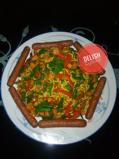 A picture of Stir-fried curry noodles and sausages.