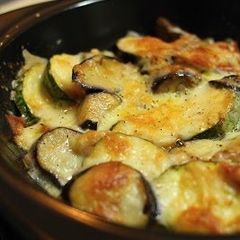 A picture of Cheesy Baked Eggplant, Zucchini, and Tomatoes.