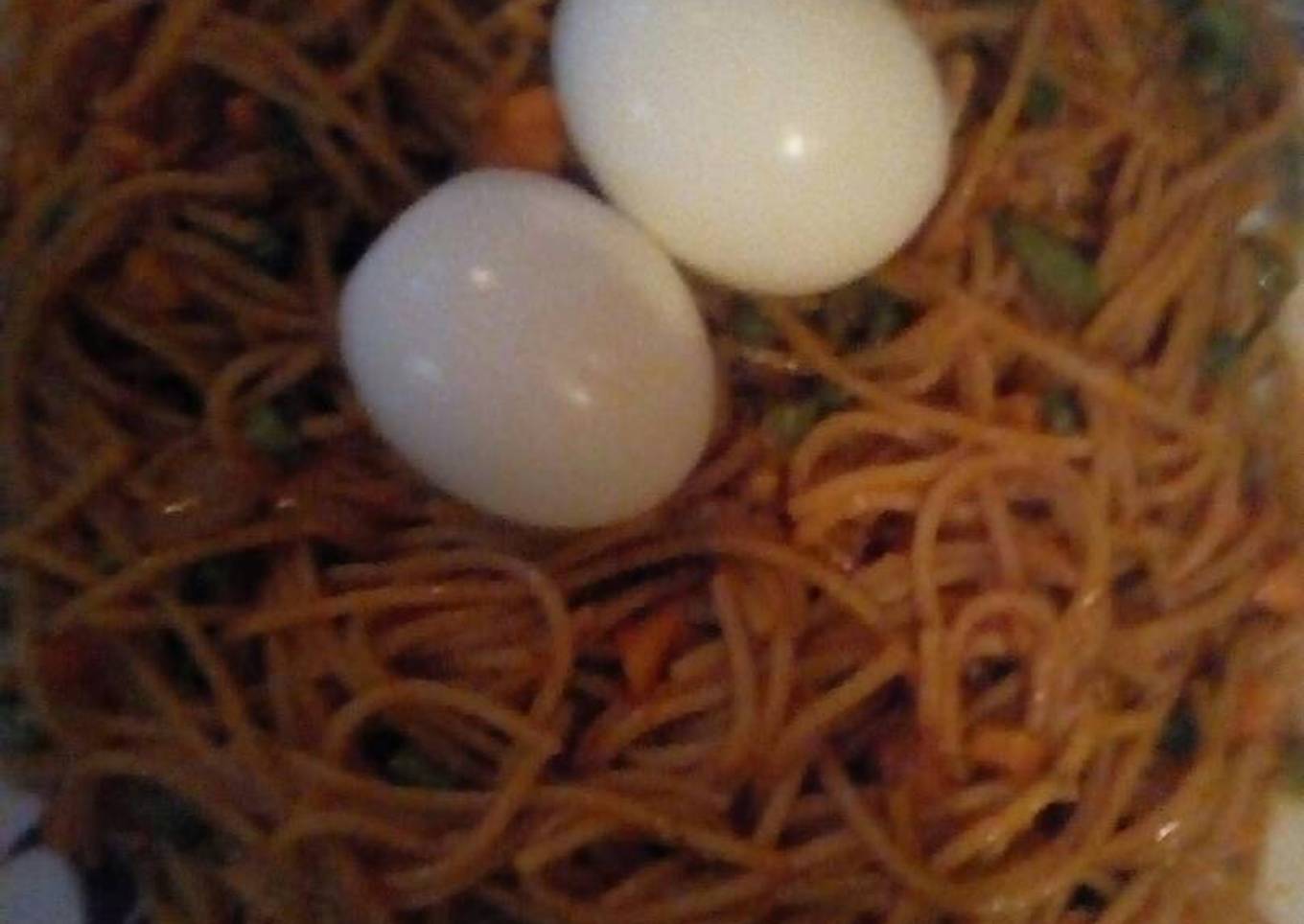 Jollof spaghetti with mix vegetable and boil egg
