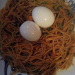Jollof spaghetti with mix vegetable and boil egg A picture of Jollof spaghetti with mix vegetable and boil egg.