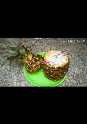 A picture of Fruit Chaat in pineapple bowl.