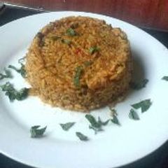 A picture of Traditional jollof rice with locust beans.
