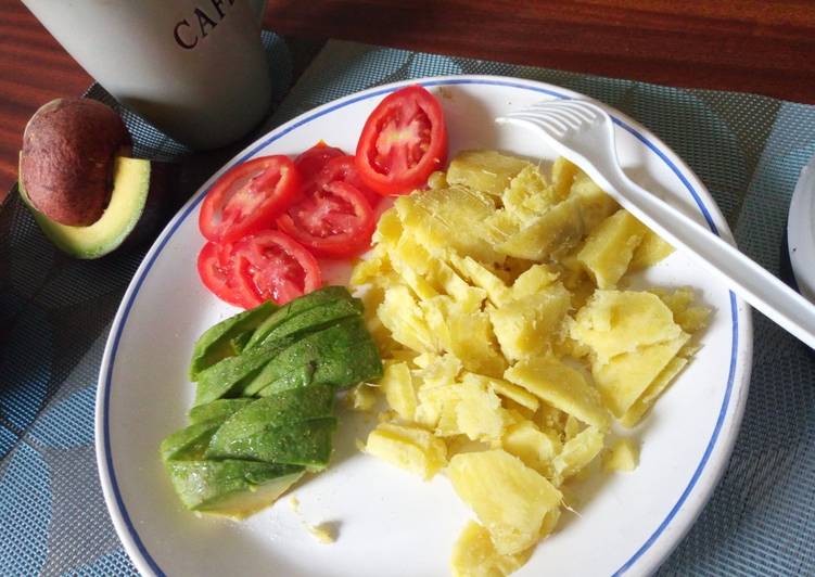 Boiled sweet potatoes with avocado and tomatoes