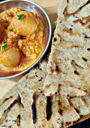 A picture of Onion curry with bajra rotla.