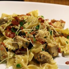 A picture of Chicken and Farfalle Pasta in a Roasted Garlic Cream Sauce.