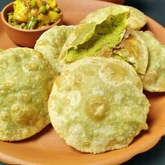 A picture of Koraishutir Kochuri/Green Peas Kachori and aloo dum.