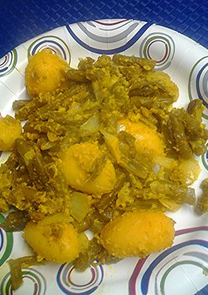 A picture of Green beans, potatoes, and cheese.