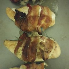 A picture of Bacon wrapped, stuffed chicken breast..