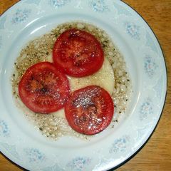 A picture of taisen's provolone cheese with balsamic vinaigrette.