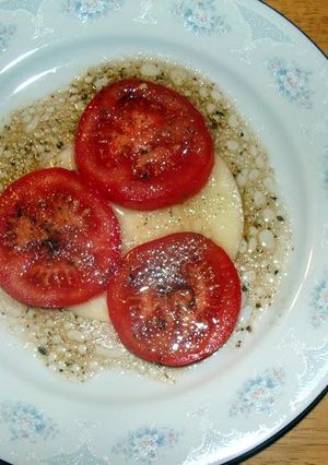 A picture of taisen's provolone cheese with balsamic vinaigrette.
