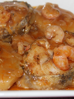A picture of Fresh Cod with Shrimp in Sauce.