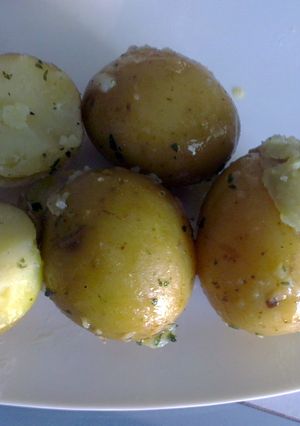 A picture of Baby new potatoes in herb butter.