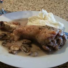 A picture of Roast turkey leg With Mushroom Gravy.