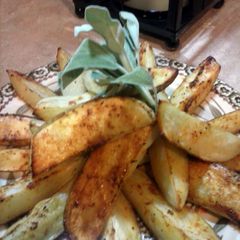 A picture of Roasted potato wedges.