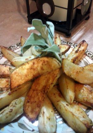 A picture of Roasted potato wedges.