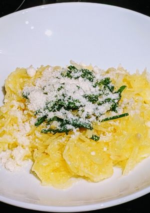 A picture of Cacio e pepe Spaghetti Squash with chive pesto.