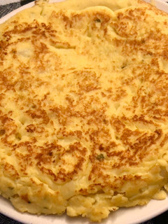 Una foto de Tortilla de patatas hervidas y calabacín hervido