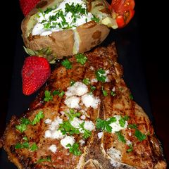 A picture of Mike's 10 Minute Rare T-Bone Steak & Baked Potato Dinner.